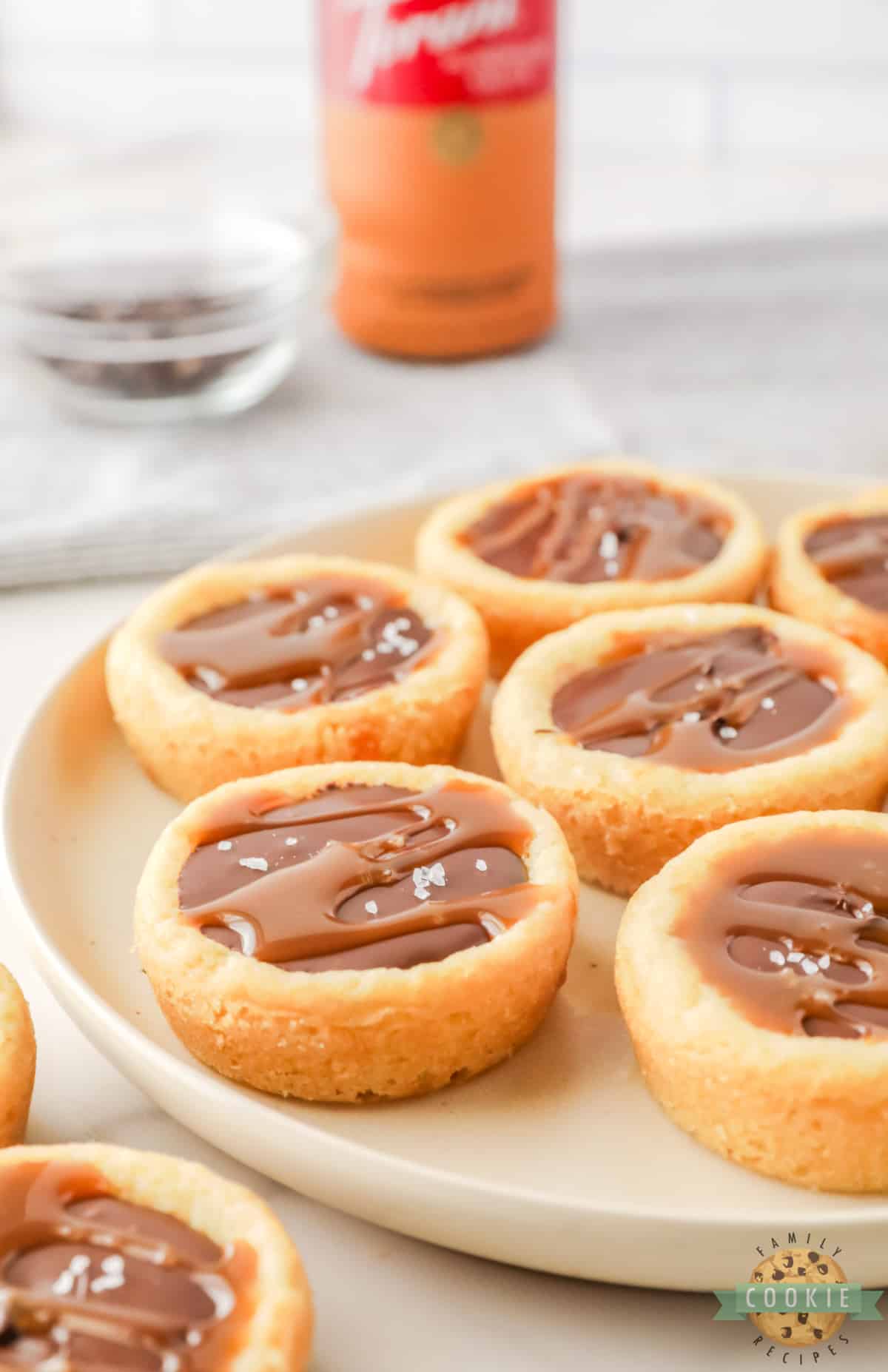Sugar cookie cup filled with caramel and chocolate. 