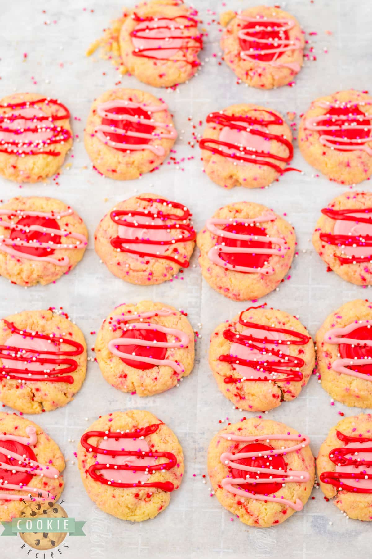 Adding drizzle and sprinkles to the cookies.