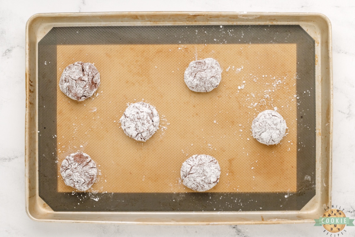 Roll cookie dough balls in powdered sugar. 