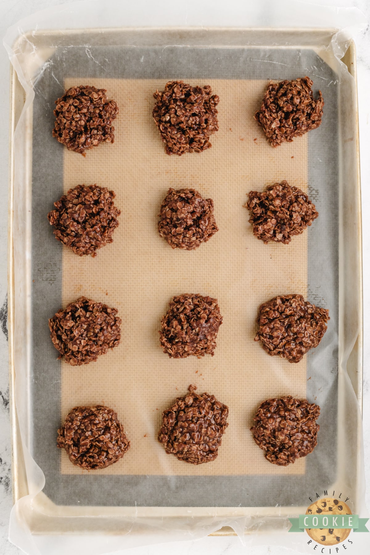 No-bake cookies scooped and dropped on wax paper. 