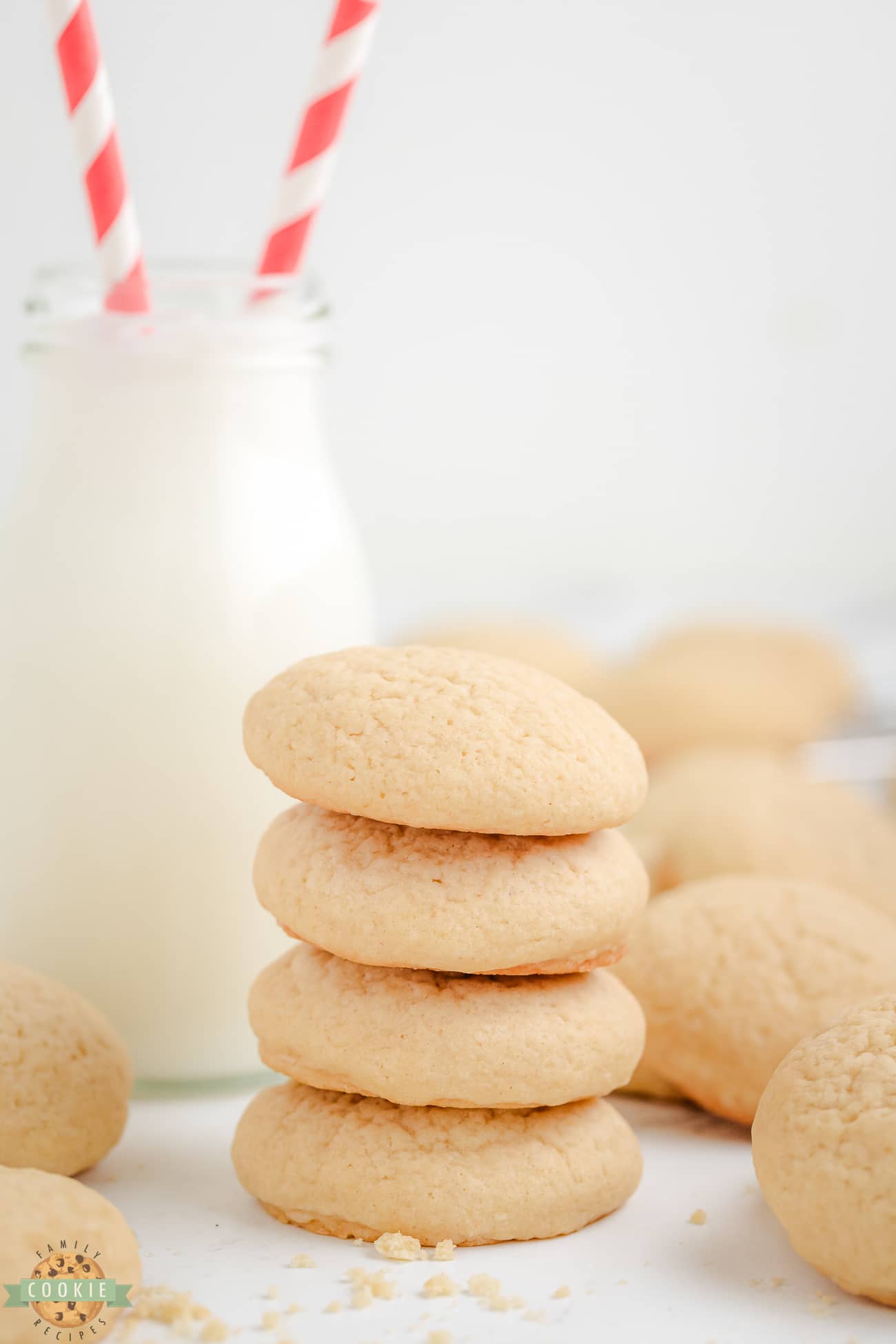 stack of homemade copycat Nilla wafer cookies with a glass of milk