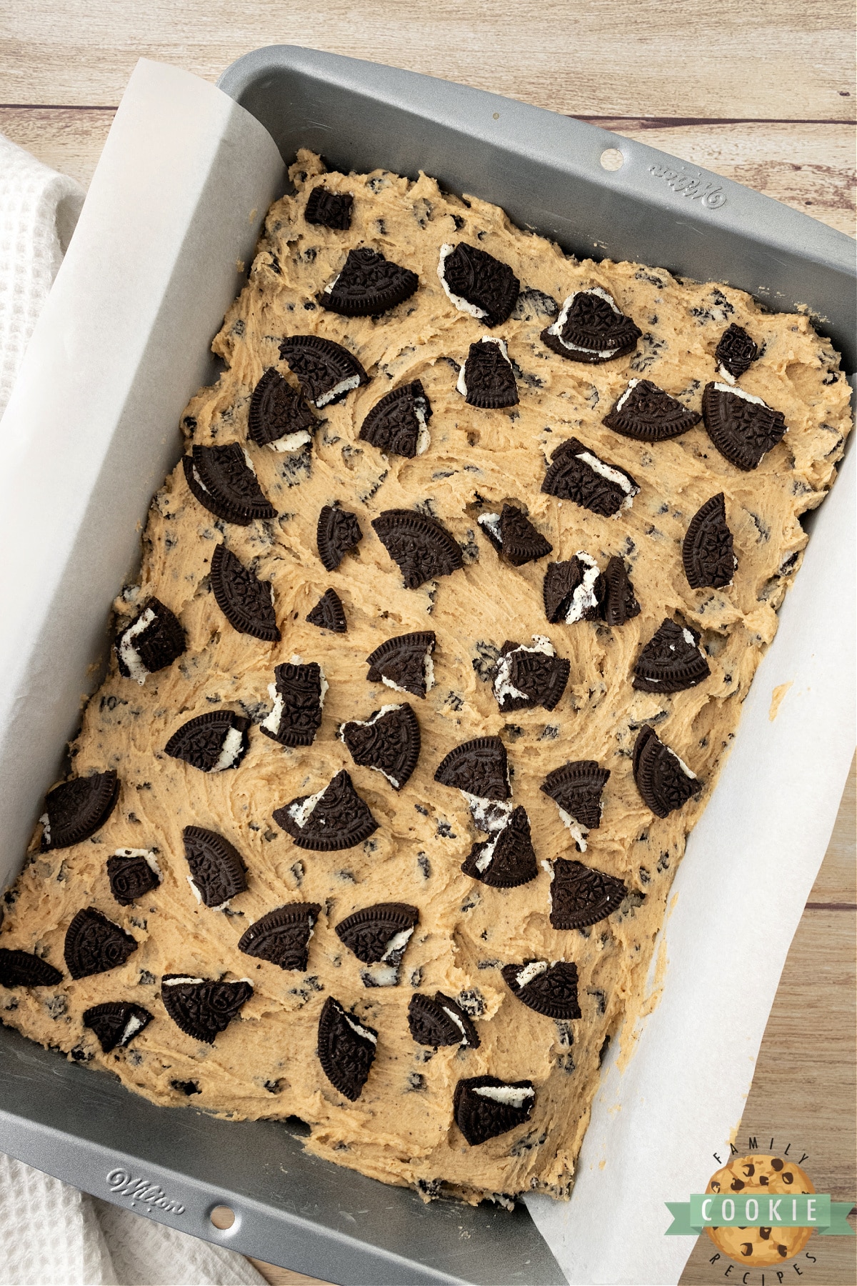 Add more chopped Oreos on top of cookie dough. 