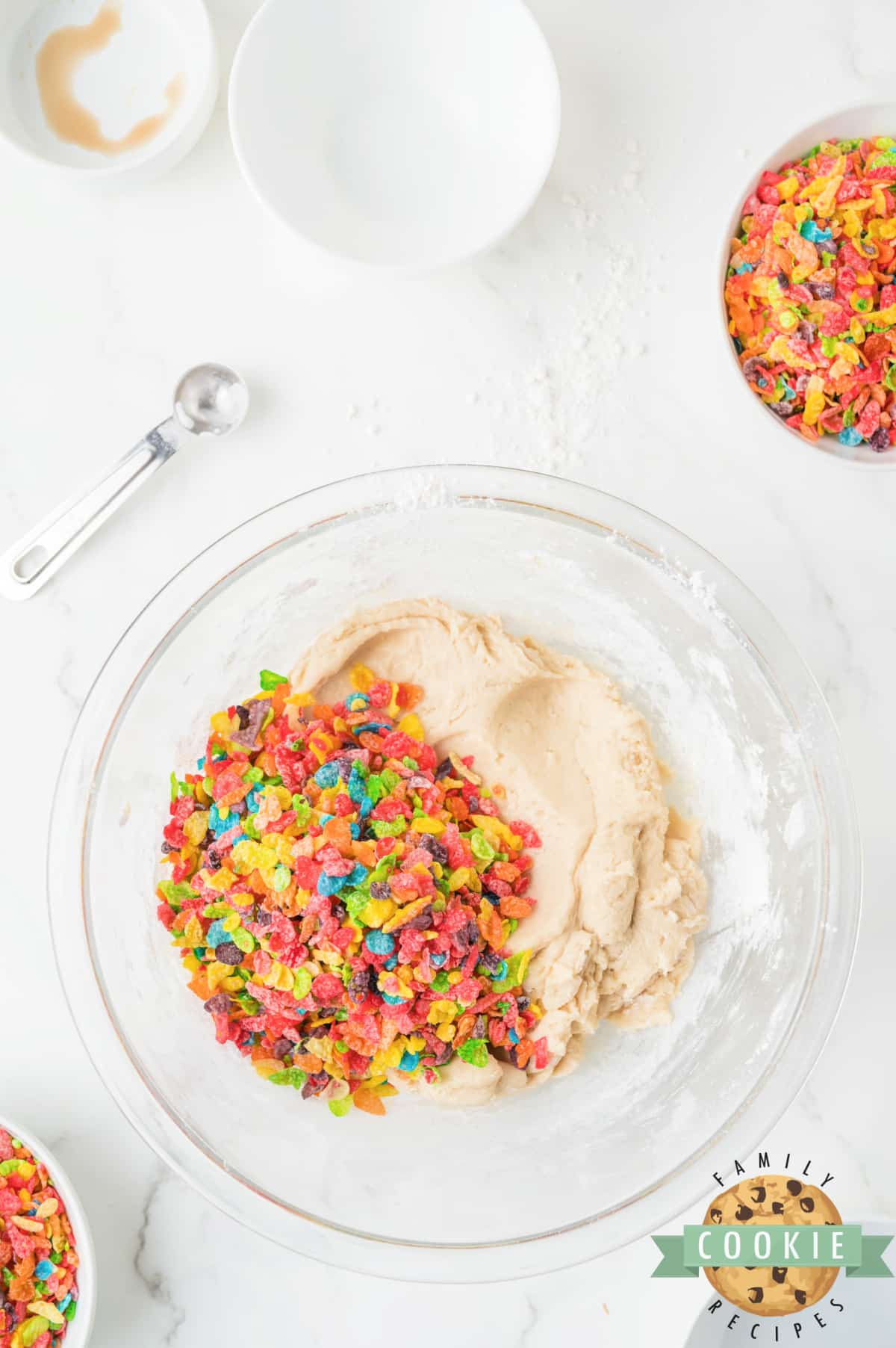 Fold Fruity Pebbles cereal into the cookie dough. 