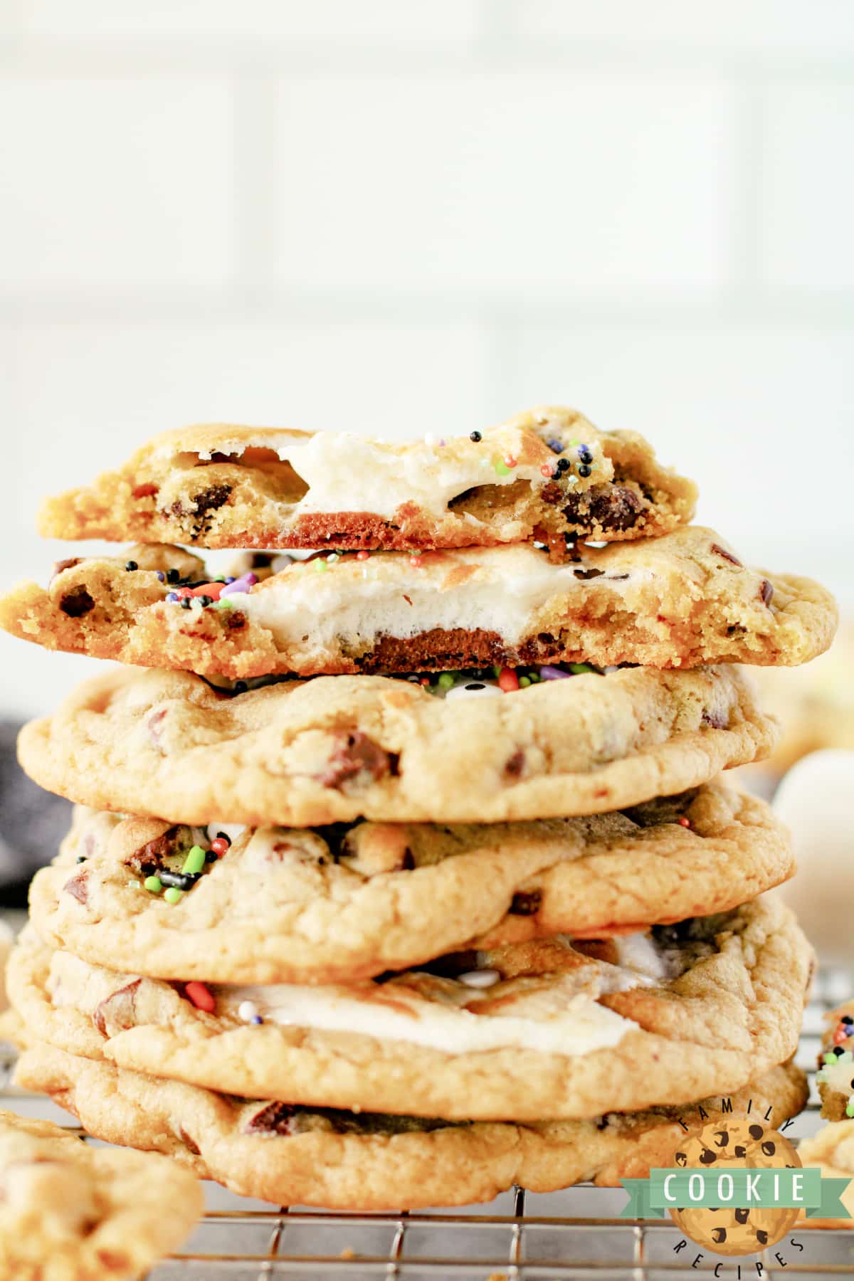 Stack of chocolate chip cookies stuffed with Hershey bars and marshmallows.