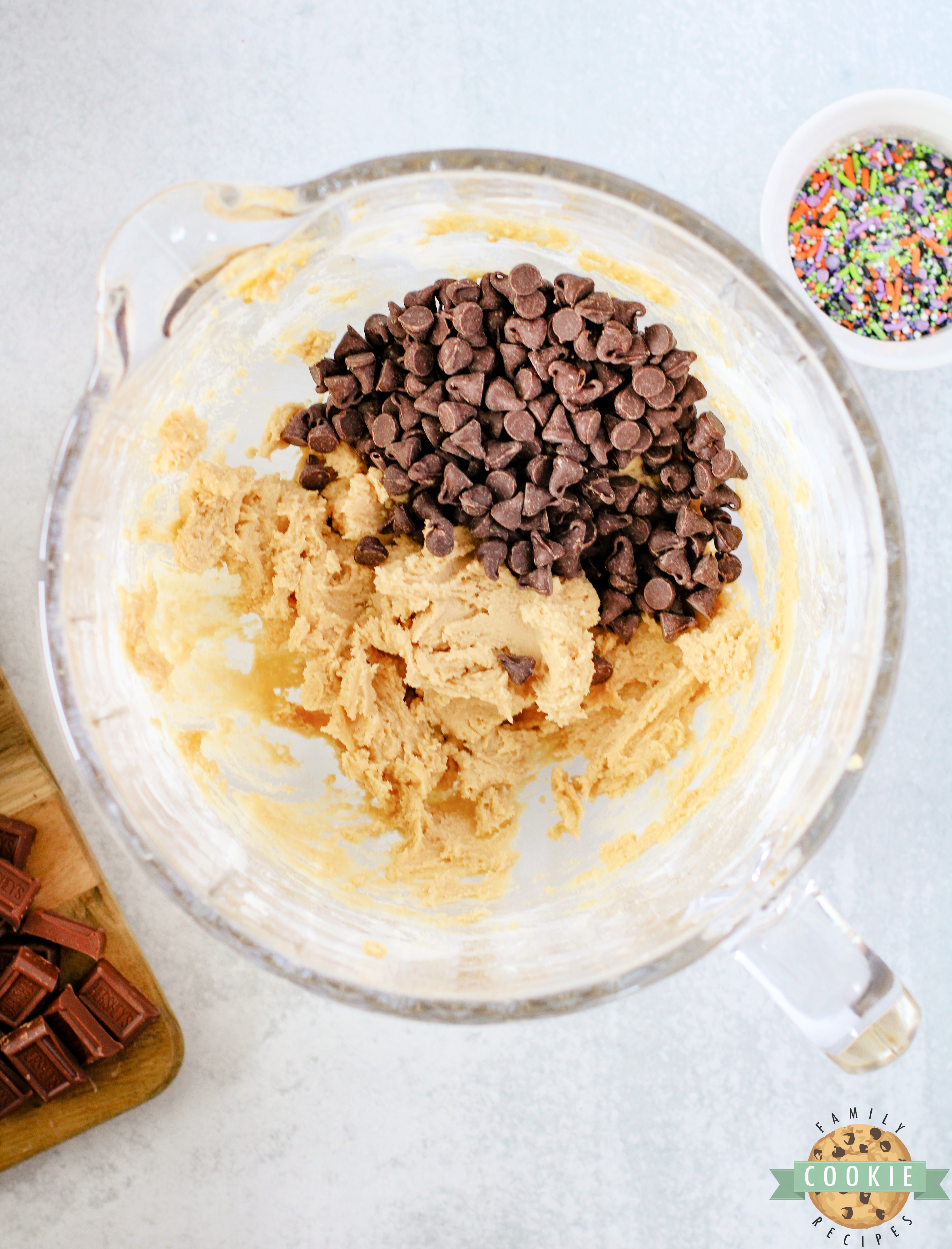 Add chocolate chips to cookie dough.