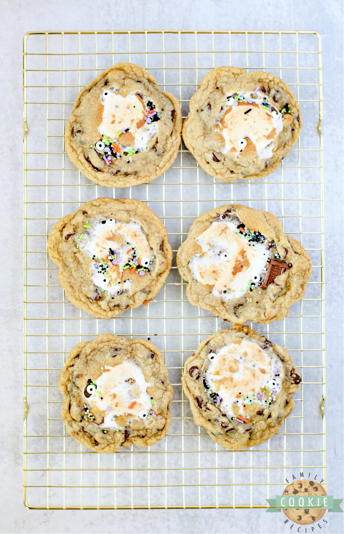 Baked chocolate chip cookies with marshmallows in the center.