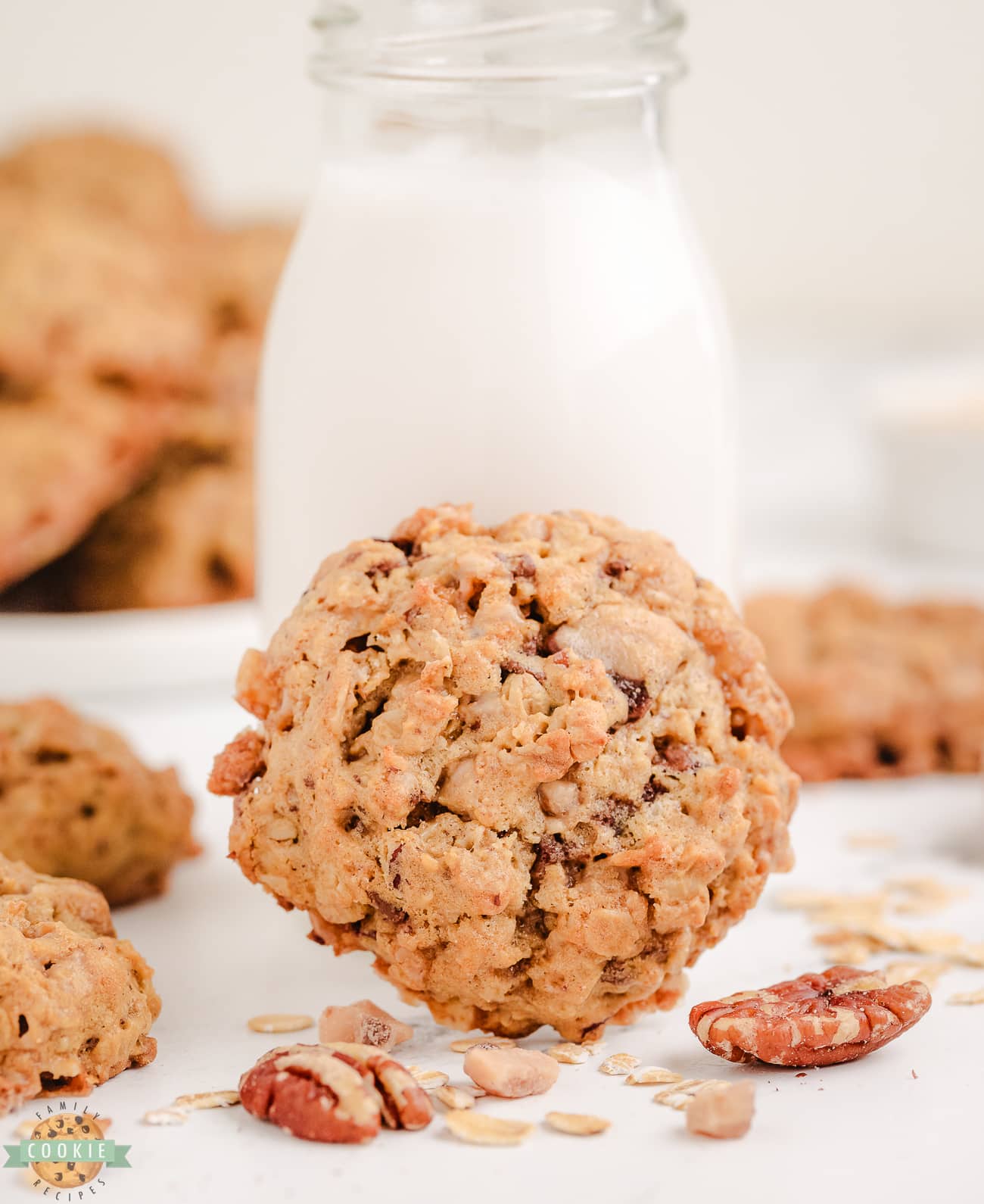 oatmeal toffee pecan cookie with a glass of milk