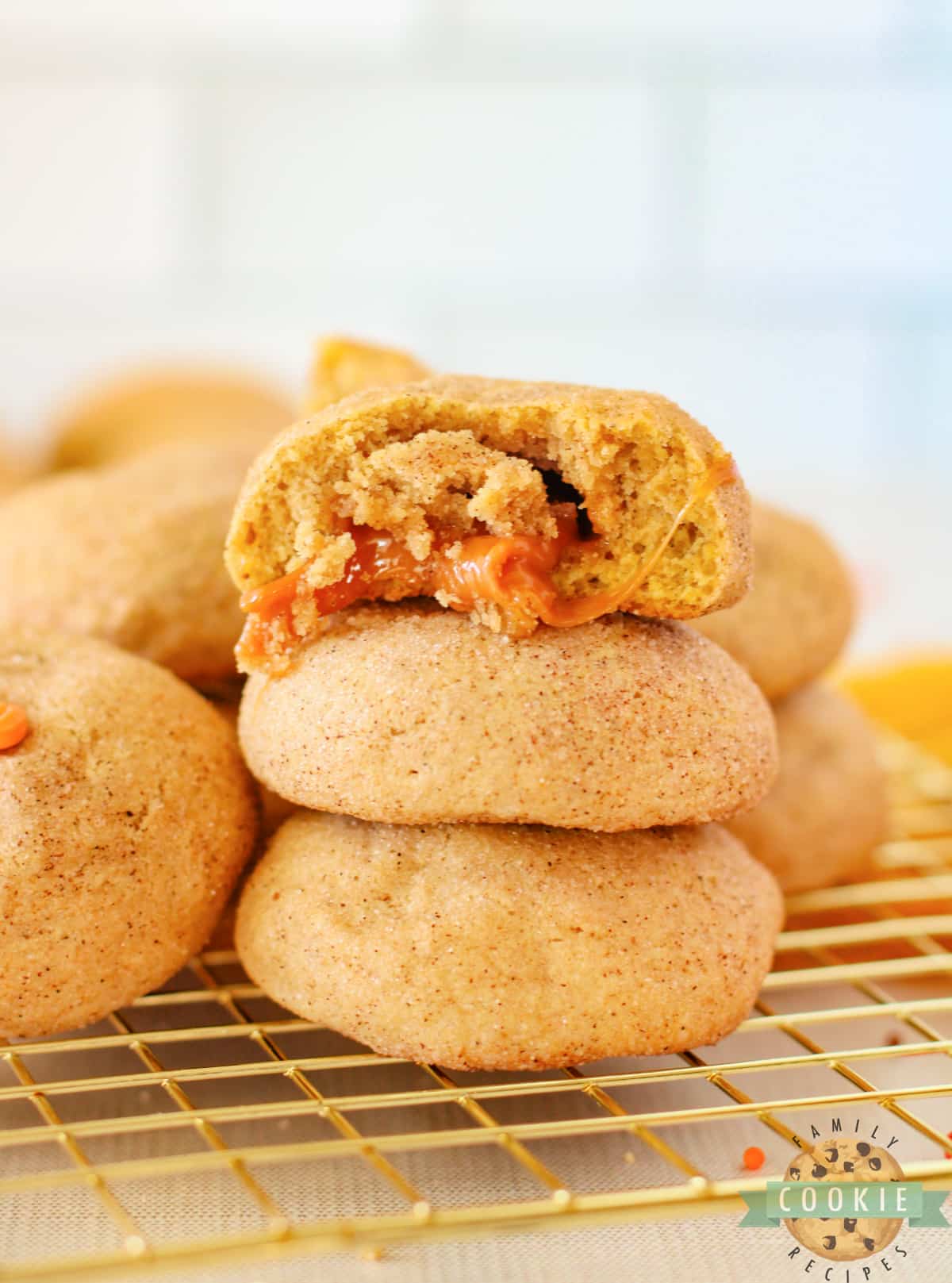 Caramel Stuffed Pumpkin Snickerdoodles are perfectly spiced cinnamon cookies with gooey caramel in the center. This is the perfect fall cookie recipe! 