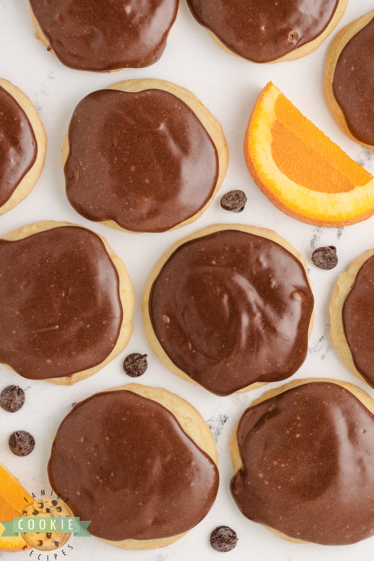 Orange cookies with fudge topping.