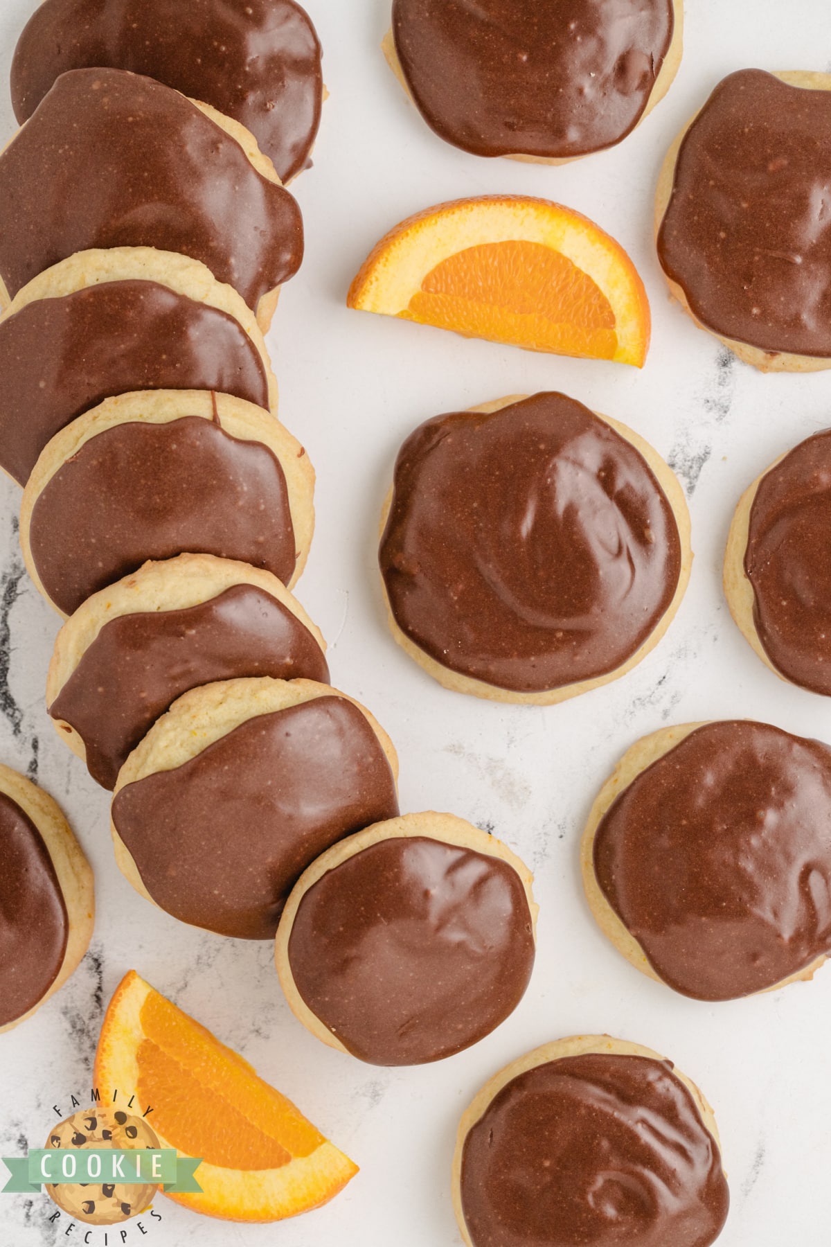 Fudge Topped Orange Cookies are soft, chewy orange cookies that are topped with a rich and creamy fudge topping. Delicious cookies made with the perfect combination of chocolate and orange.