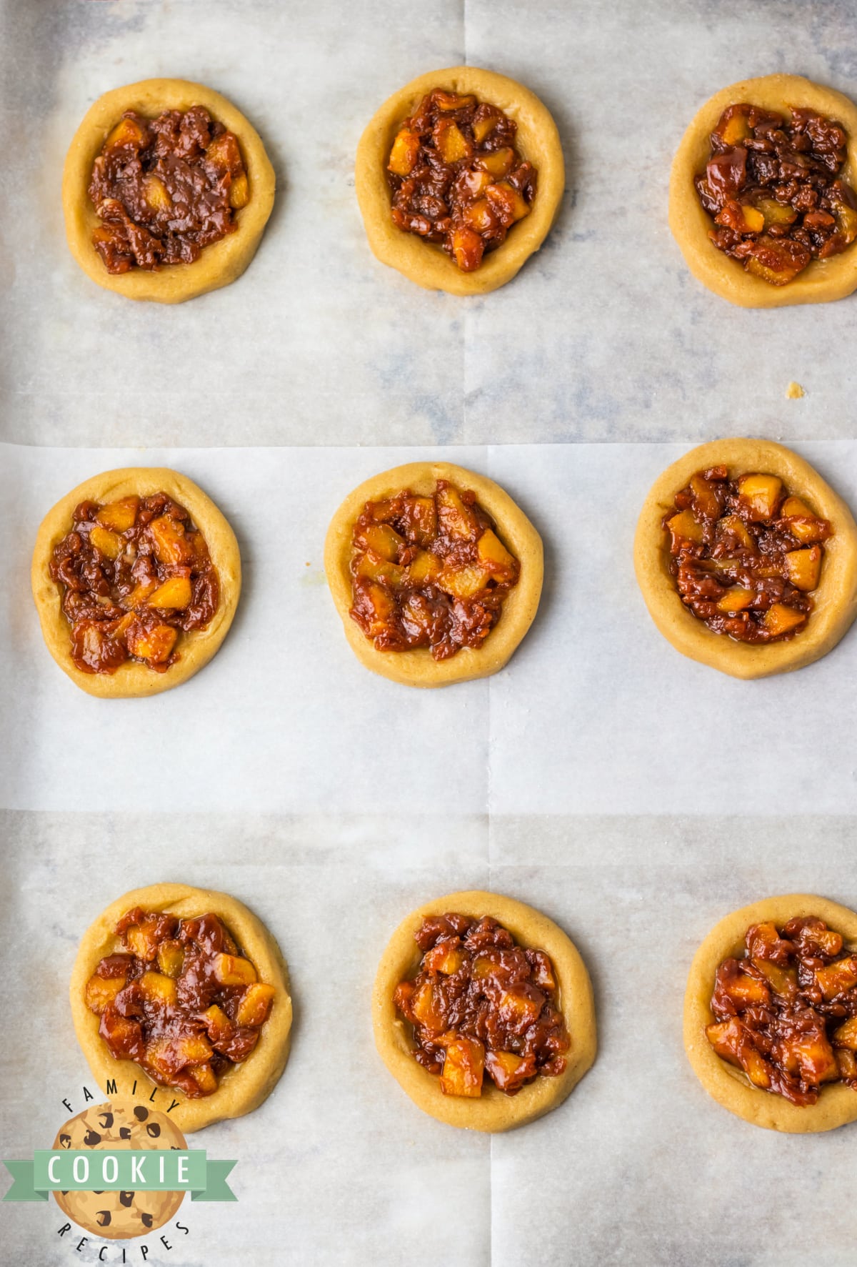 Apple filling on top of cookie dough.