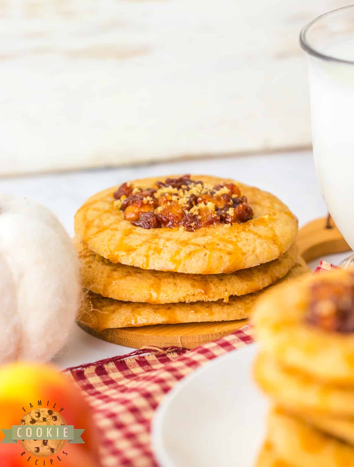 Spiced Apple Thumbprint Cookies are soft cinnamon cookies with gooey, spiced apples on top. Drizzle caramel on top and serve these delicious apple cookies with a scoop of vanilla ice cream!