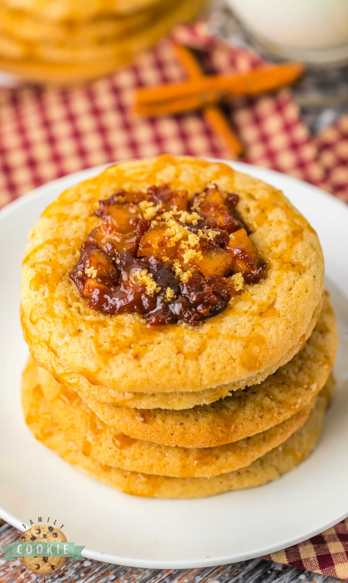 Spiced Apple Thumbprint Cookies are soft cinnamon cookies with gooey, spiced apples on top. Drizzle caramel on top and serve these delicious apple cookies with a scoop of vanilla ice cream!