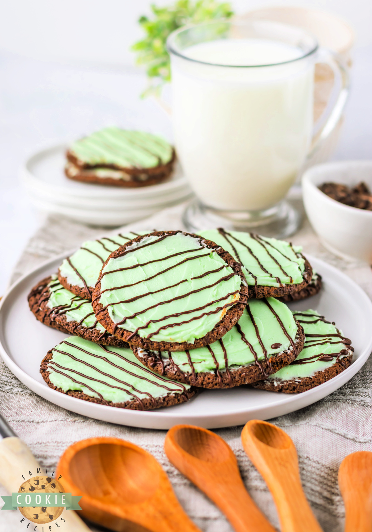 Plate of chocolate cookies with mint frosting. 