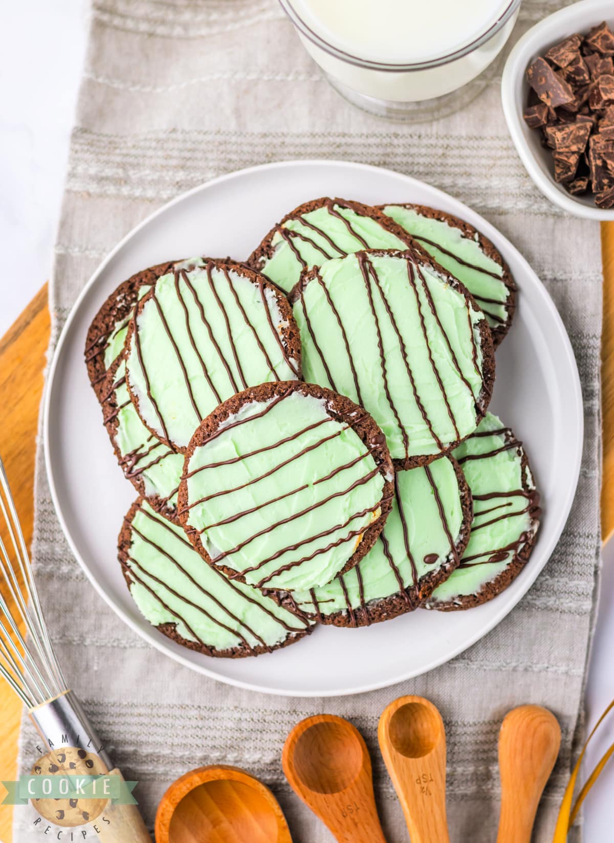 Frosted Mint Chocolate Cookies are soft cookies topped with mint frosting that taste very similar to the Girl Scout Thin Mint cookies that we all know and love. An easy cookie recipe that is great for St. Patrick's Day, Christmas, or pretty much any time during the year!