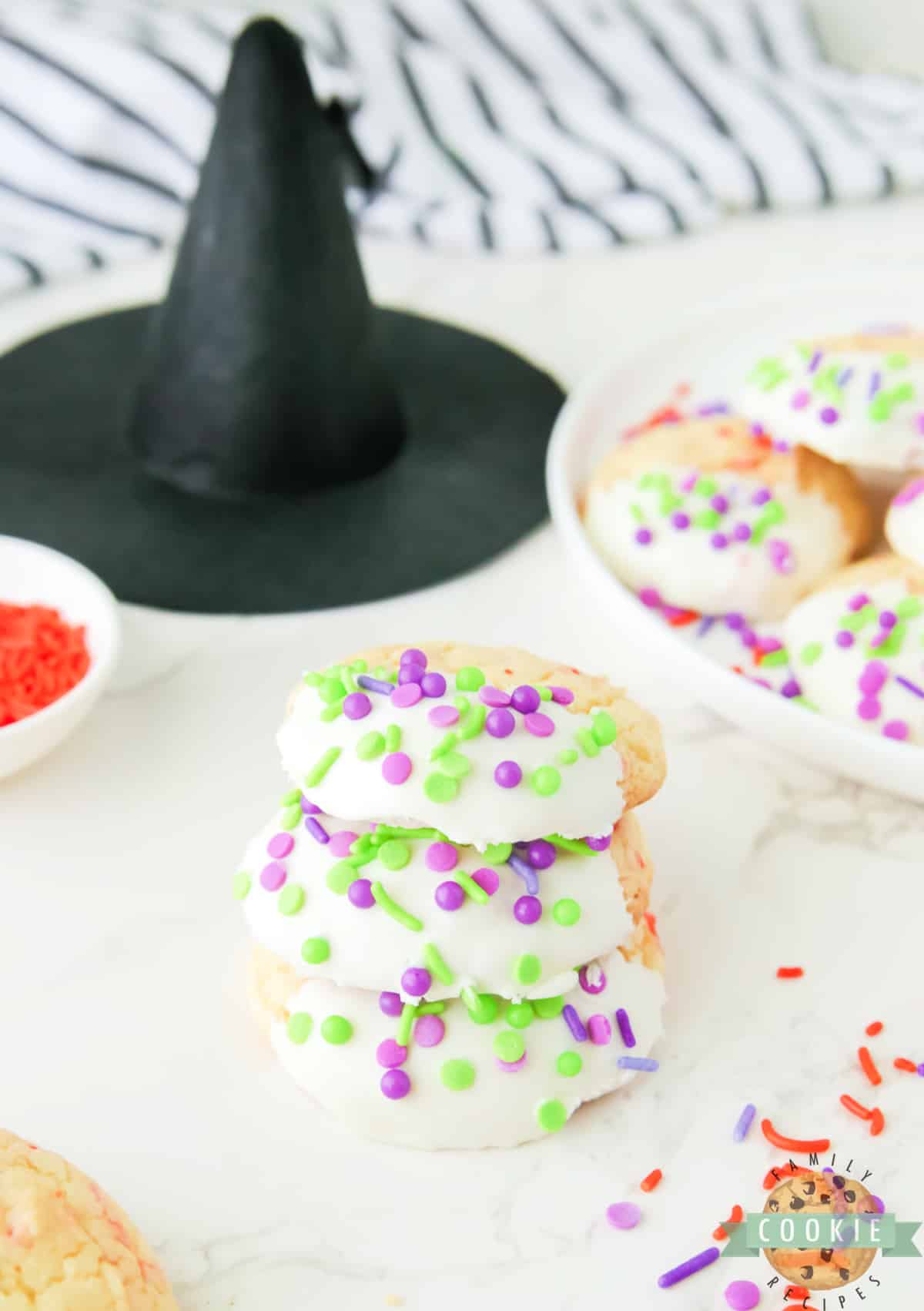 Cake mix cookies dipped in vanilla frosting. 