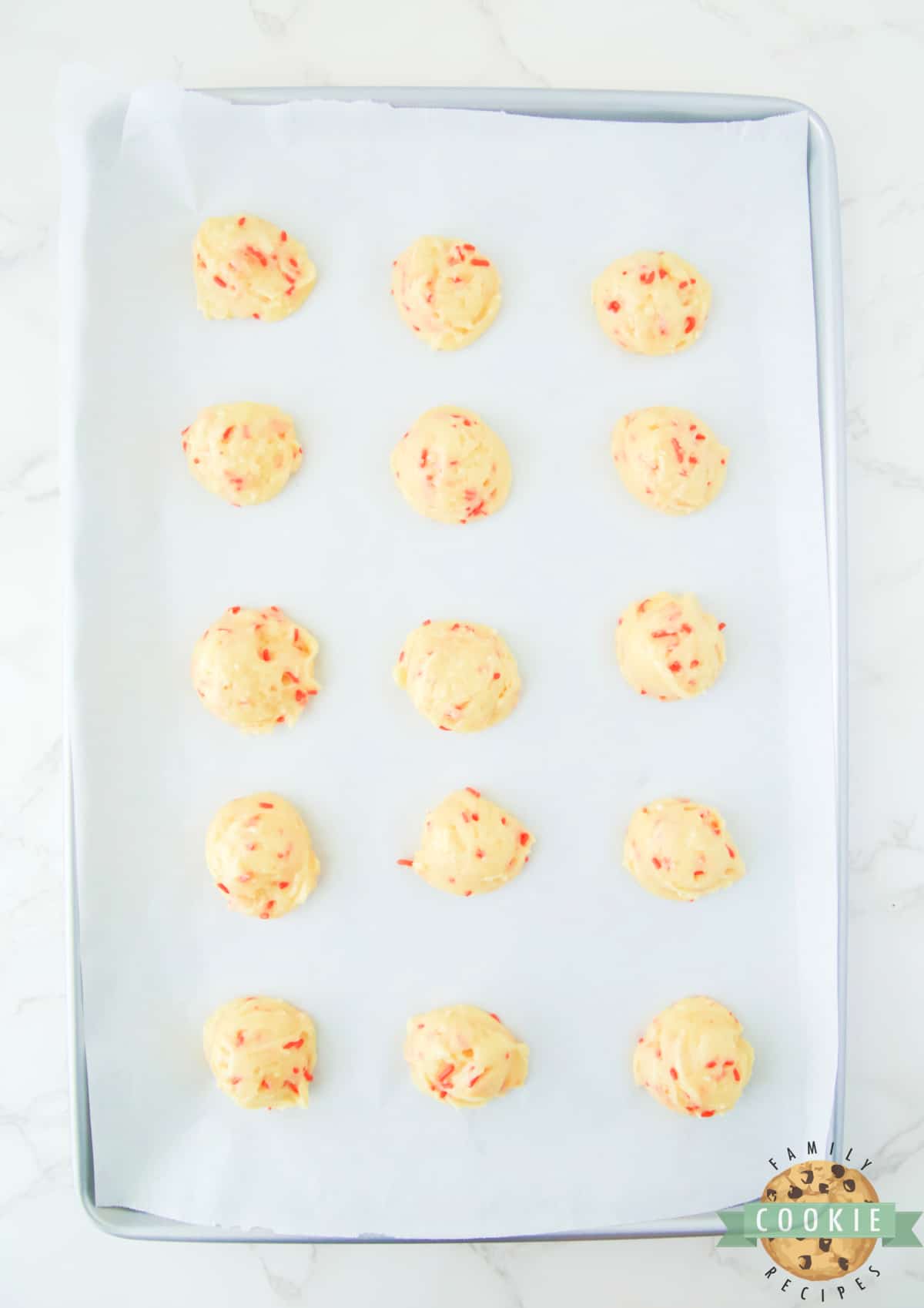 Balls of cookie dough with sprinkles. 