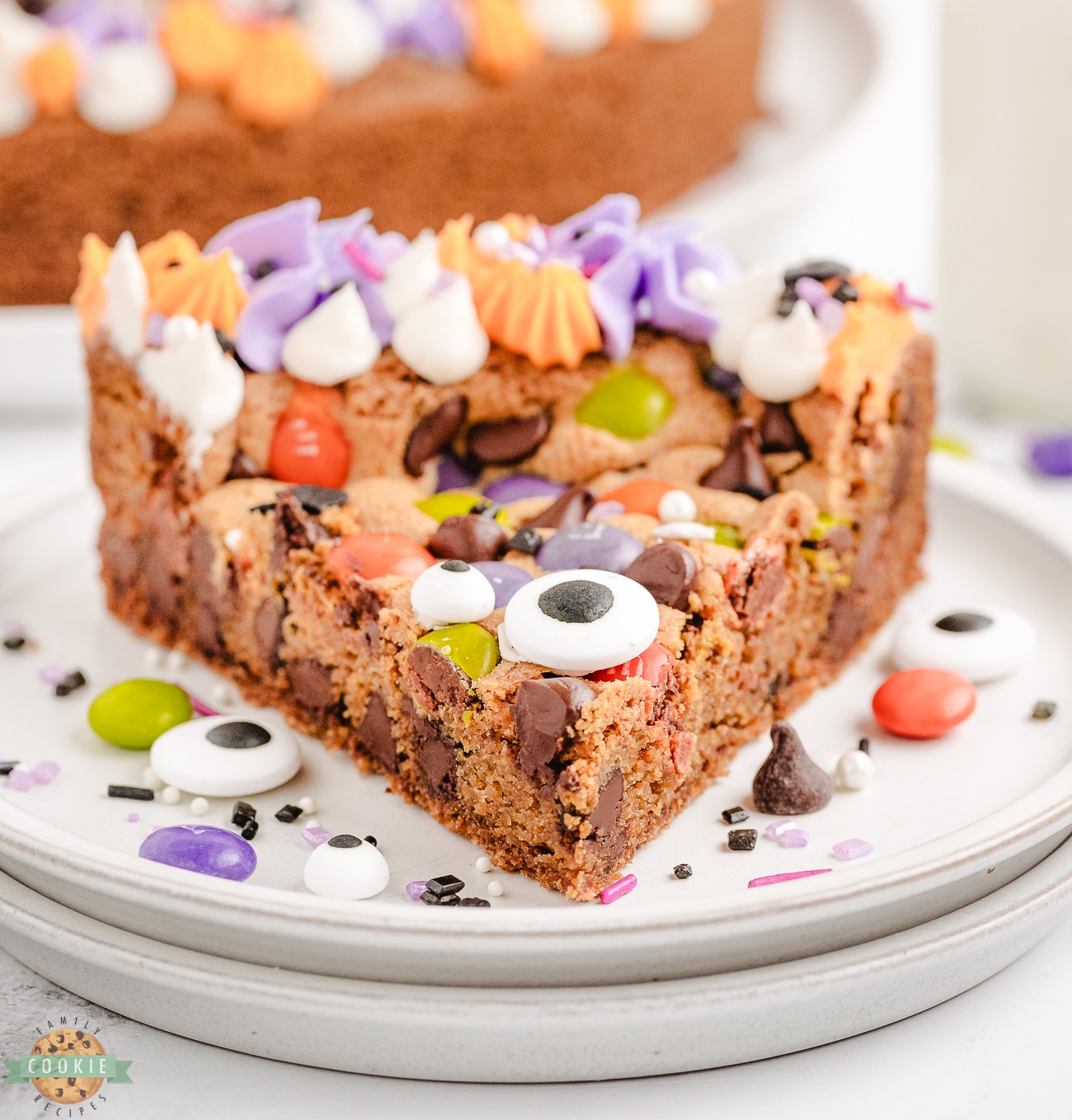 slice of Halloween cookie cake with candy eyeballs on top