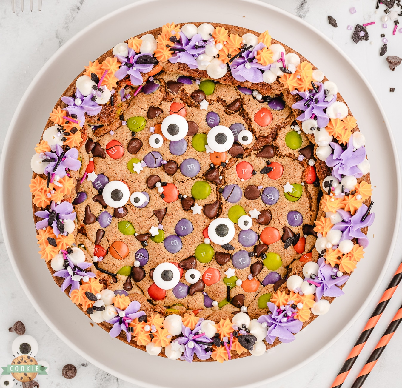 Halloween cookie pie with frosting and sprinkles on top