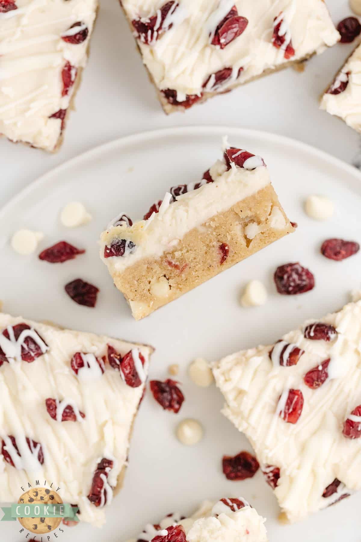 White Chocolate Cranberry Cookie Bars are soft, chewy, and covered with cream cheese frosting and a white chocolate drizzle. This is a fantastic cookie bar recipe that is perfect for fall!