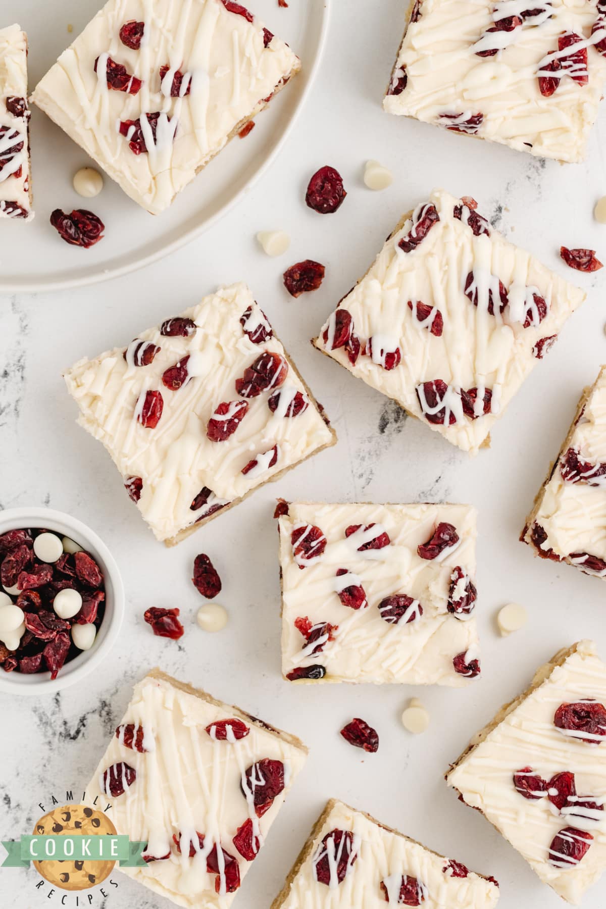 White Chocolate Cranberry Cookie Bars are soft, chewy, and covered with cream cheese frosting and a white chocolate drizzle. This is a fantastic cookie bar recipe that is perfect for fall!