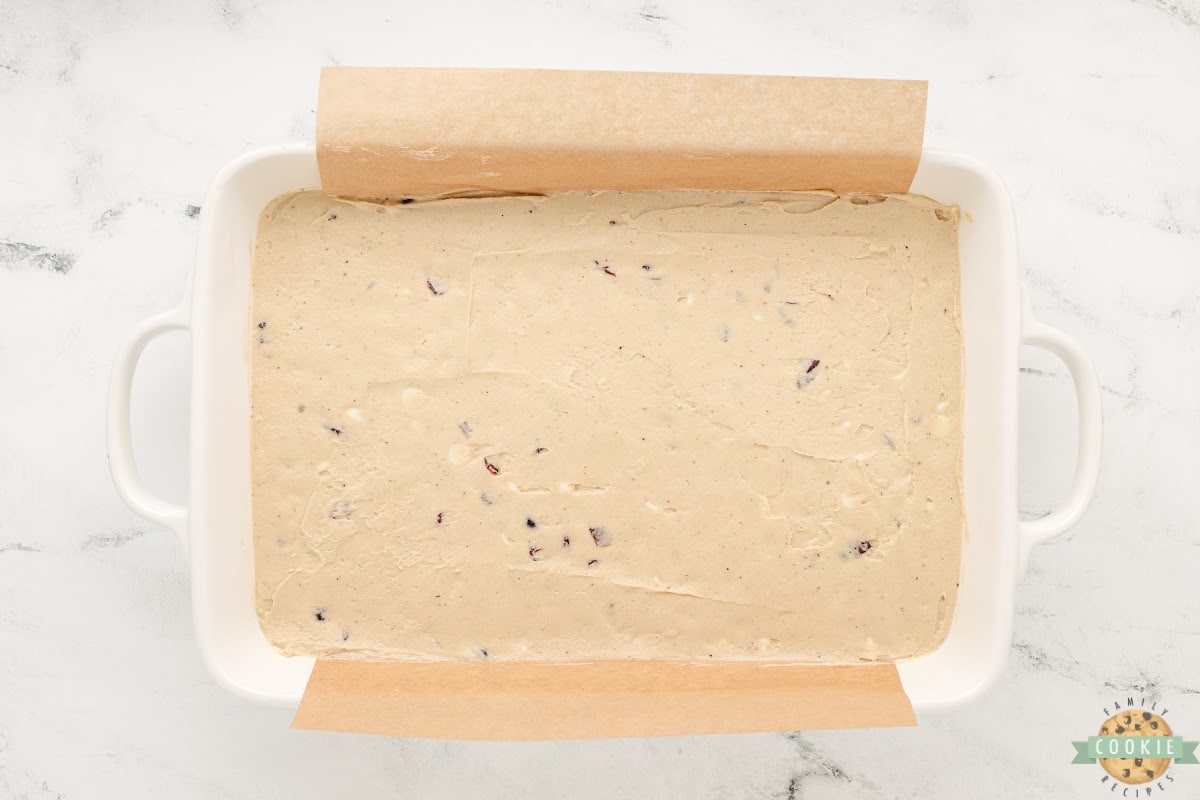 Spread cookie dough in a 9X13 lined with parchment paper.