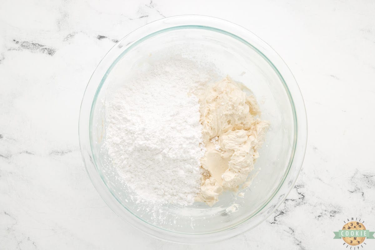 Add powdered sugar to cream cheese frosting recipe.