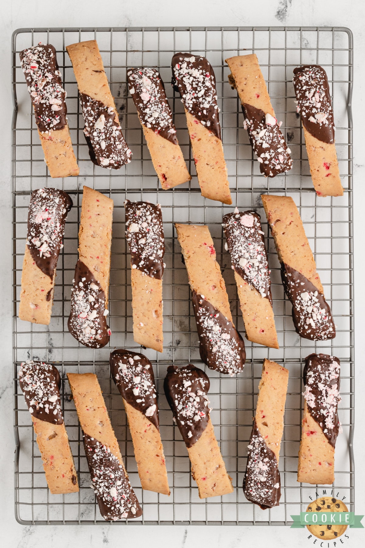 Peppermint biscotti dipped in chocolate and topped with crushed peppermint.