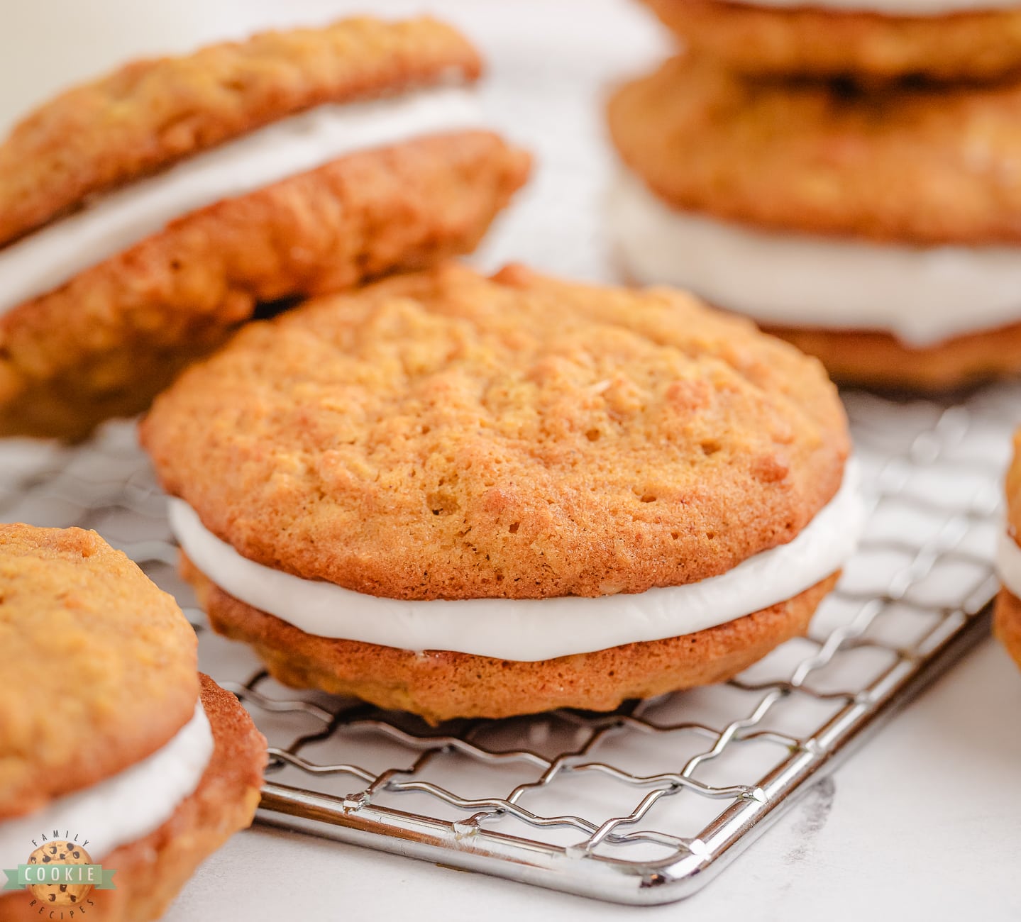 pumpkin oatmeal sandwich cookies on a cooling rack