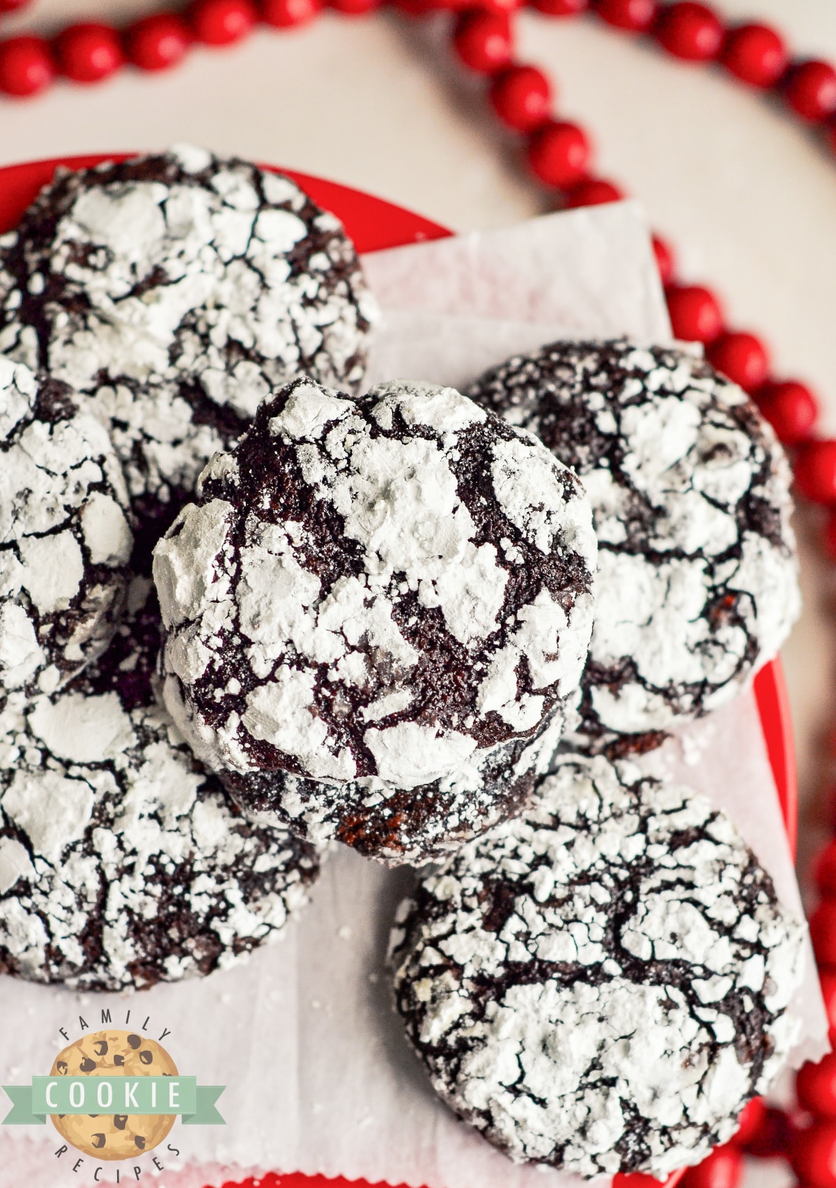 Raspberry Chocolate Crinkle Cookies are soft, chewy, and full of flavor. Adding raspberry preserves gives this classic chocolate crinkle cookie recipe a delicious twist! 