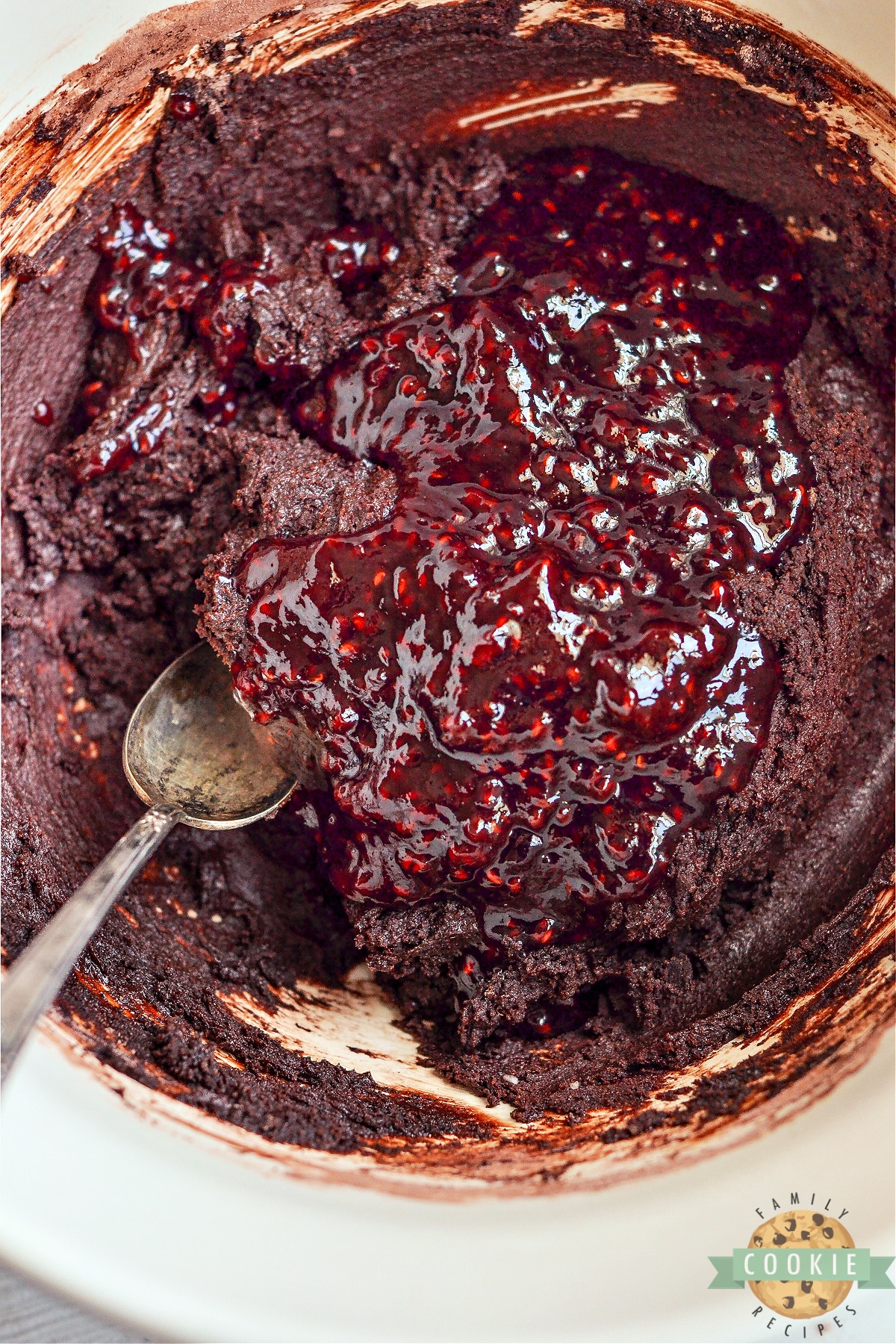 Add raspberry preserves to the chocolate cookie dough. 