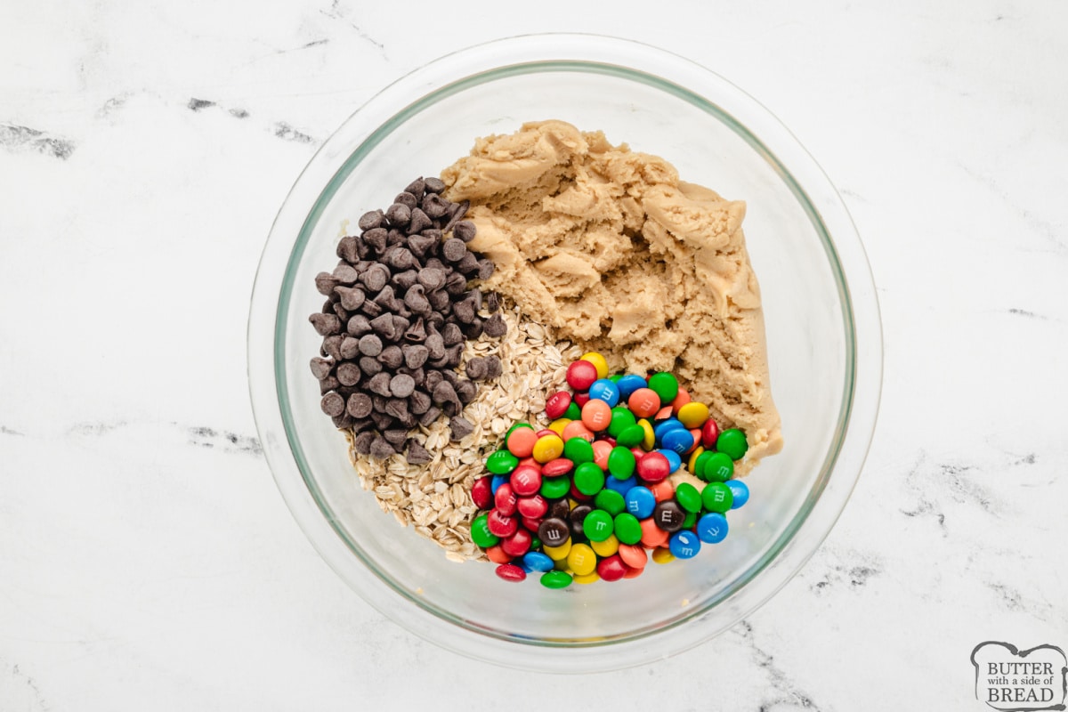 Add chocolate chips, oats, and M&ms to the cookie dough.