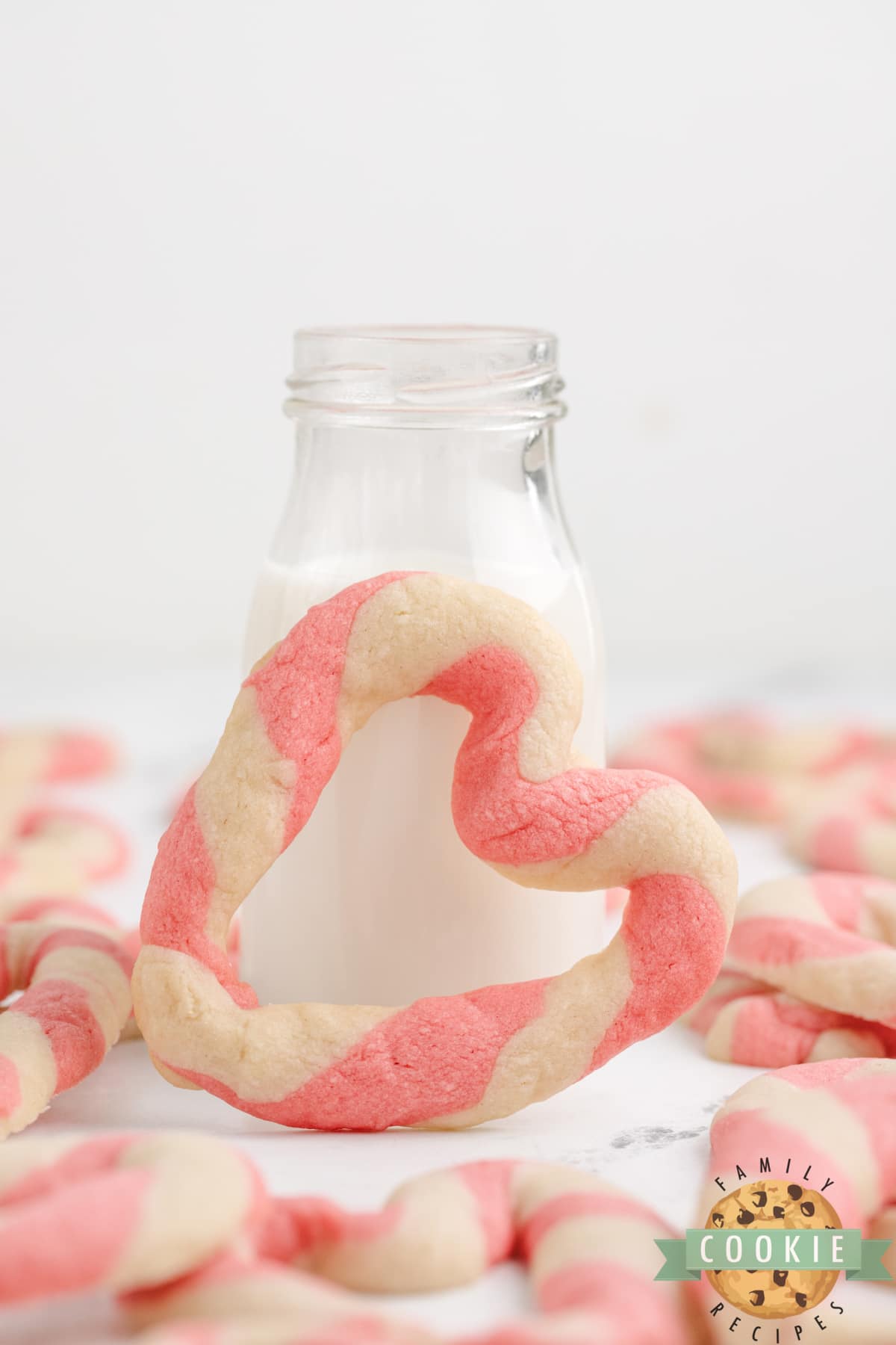 Braided Sweetheart Cookies are simple sugar cookies formed into pink and white striped hearts. These heart-shaped cookies are easy to make and are so pretty, you don't even need frosting!