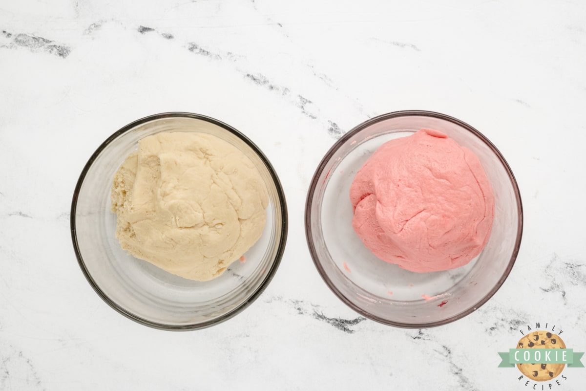 Dough divided in half, with half dyed pink. 