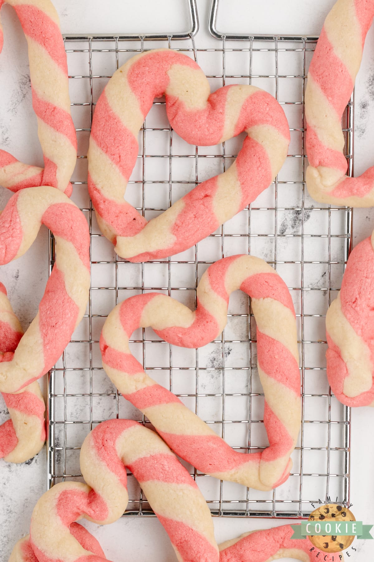 Braided Sweetheart Cookies are simple sugar cookies formed into pink and white striped hearts. These heart-shaped cookies are easy to make and are so pretty, you don't even need frosting!