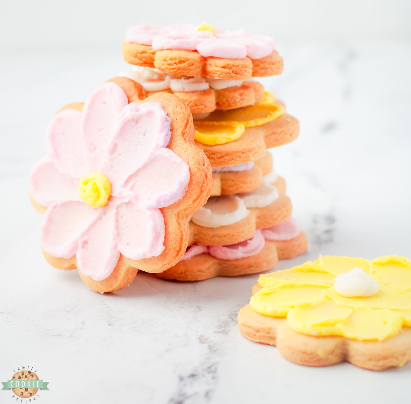 stack of buttercream flower cookies