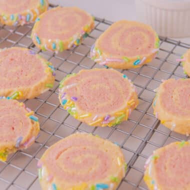 pink pinwheel cookies on a cooling rack