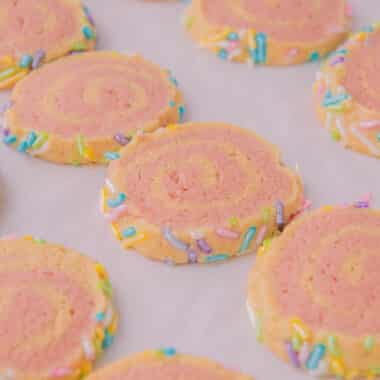 old fashioned pink pinwheel cookies on a baking sheet