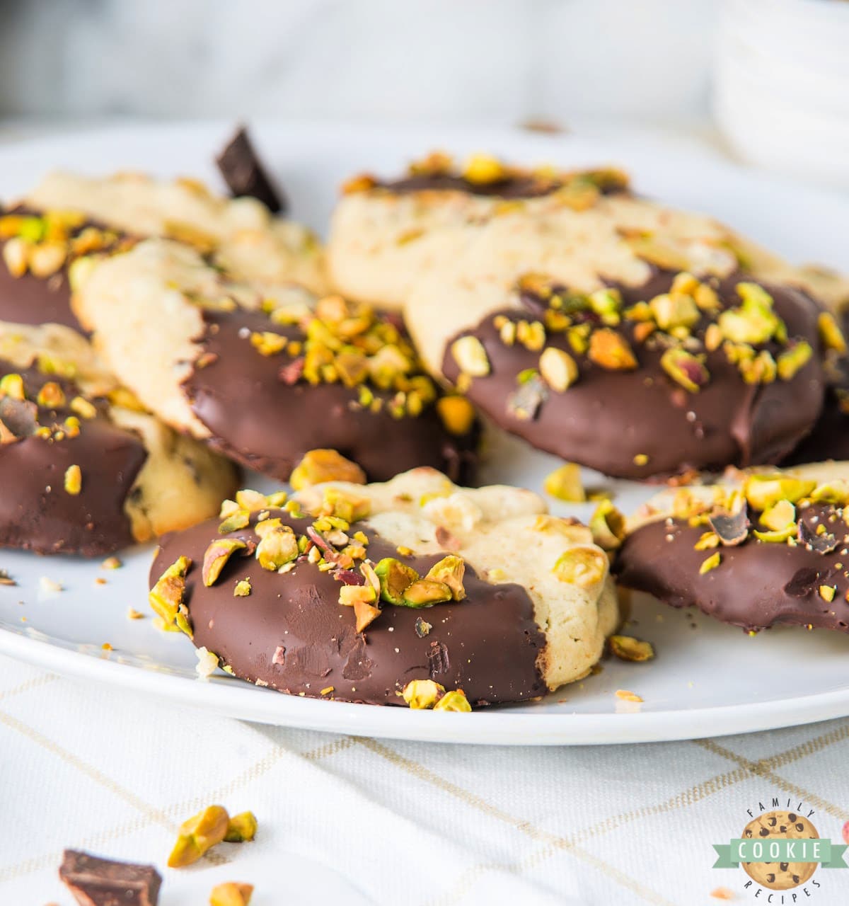 Chocolate Dipped Pistachio Cookies are soft and chewy pistachio cookies coated with dark chocolate. Freeze the dough and then slice and bake when ready to eat!