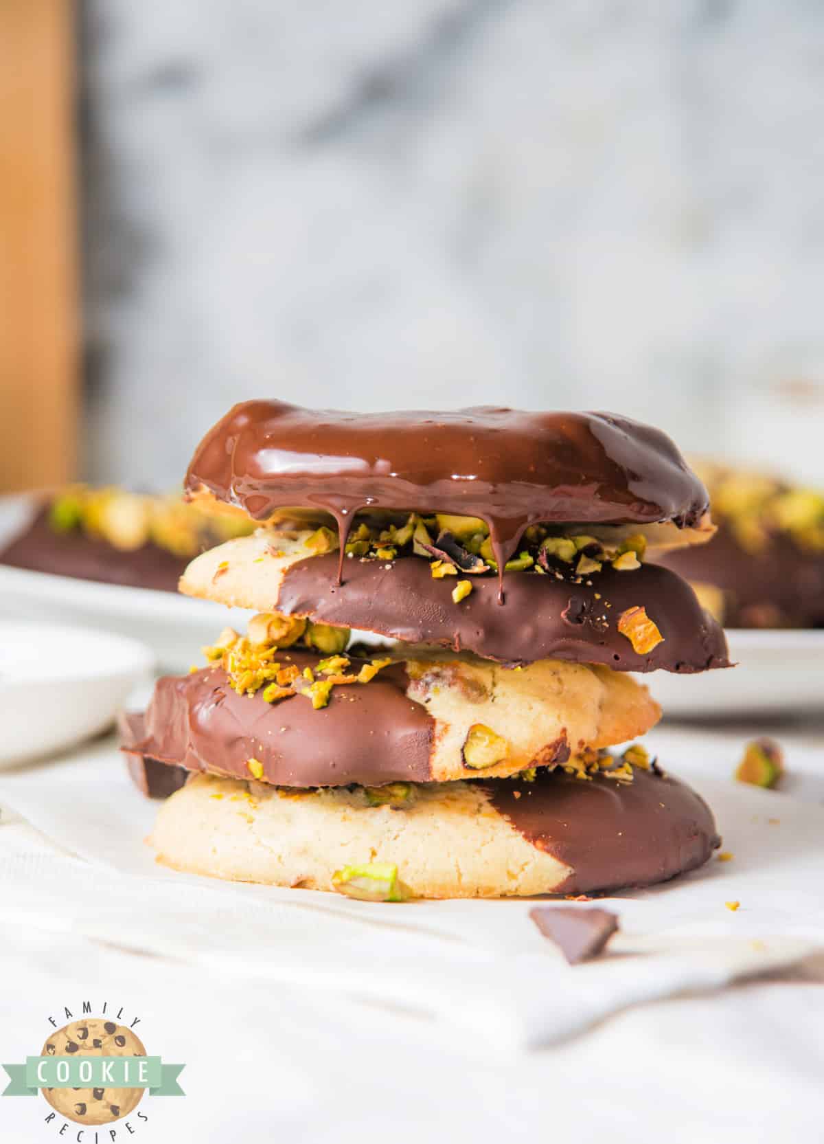 Pistachio cookies dipped in chocolate.