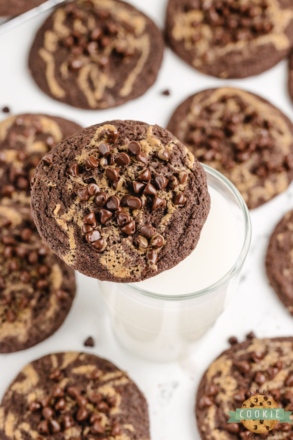 Chocolate Peanut Butter Swirl Cookies are soft, chewy, and delicious! These rich chocolate cookies have a swirl of peanut butter and a sprinkling of mini chocolate chips on top.