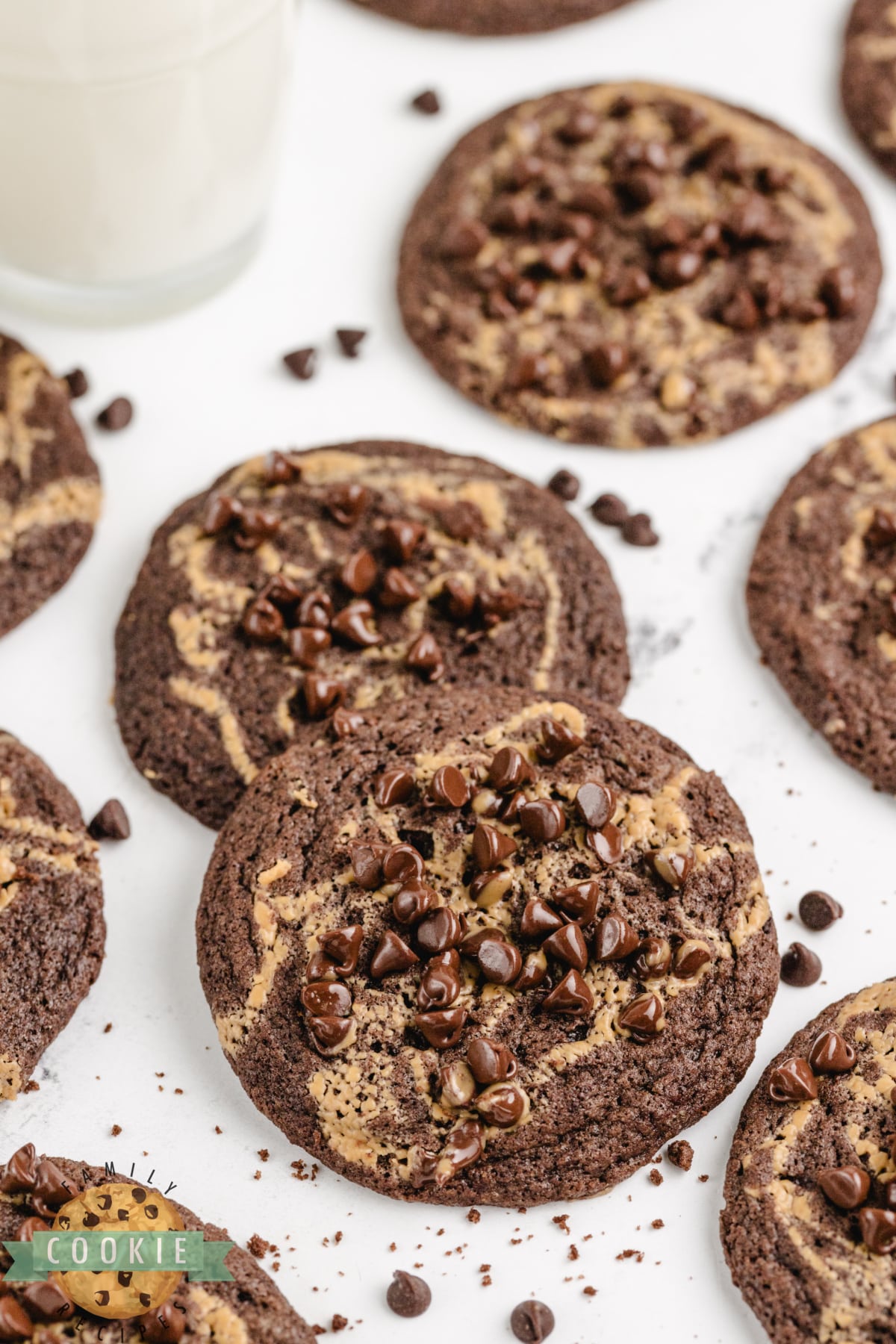 Chocolate Peanut Butter Swirl Cookies are soft, chewy, and delicious! These rich chocolate cookies have a swirl of peanut butter and a sprinkling of mini chocolate chips on top.