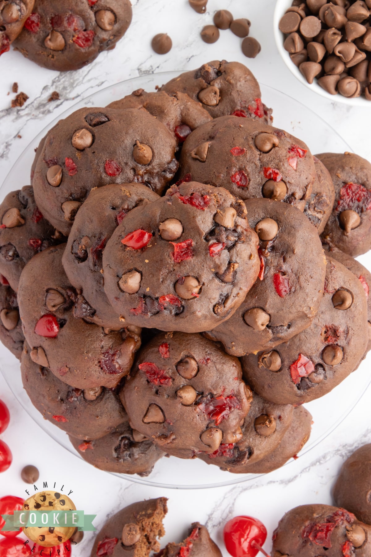 Double Chocolate Banana Split Cookies are made completely from scratch with bananas, chocolate chips, and maraschino cherries. These chewy chocolate cookies taste just like a banana split  - especially if you add a scoop of vanilla ice cream! 