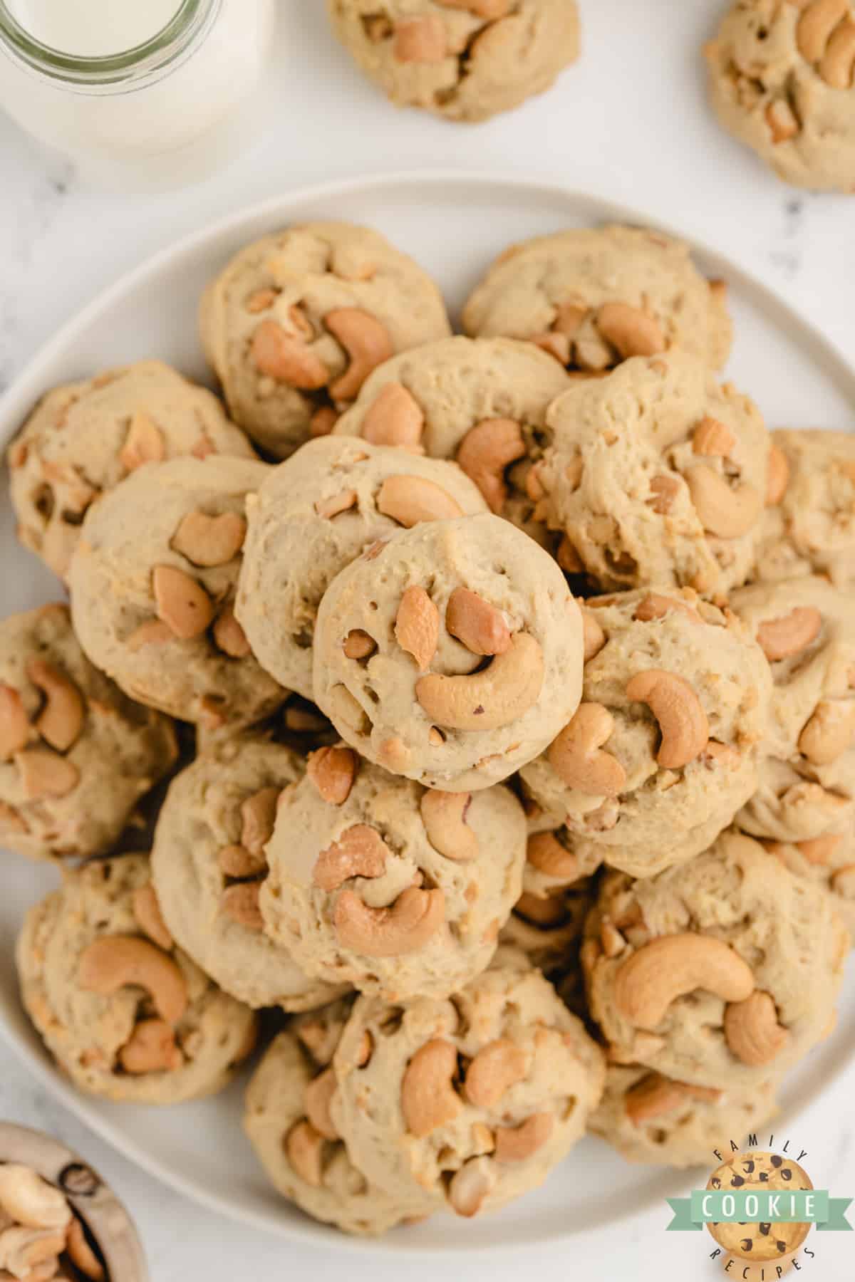 Plate of thick and chewy cookies made with cashews.