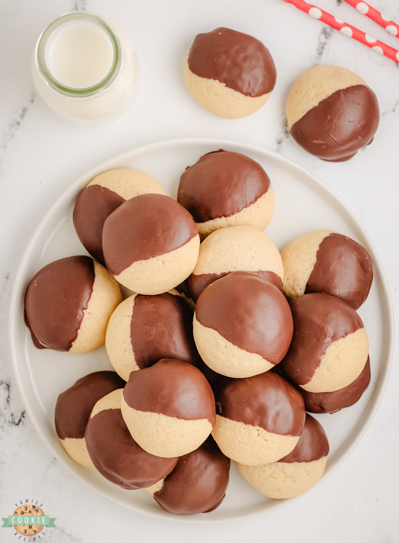 plateful of soft vanilla cookies dipped in chocolate