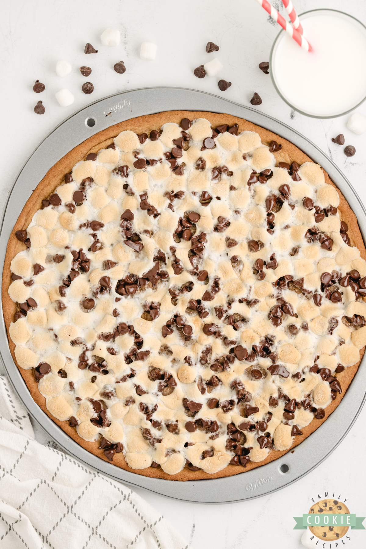 Peanut Butter Cookie Pizza is chewy, gooey, and loaded with marshmallows and chocolate. A fast, fun dessert everyone will love!
