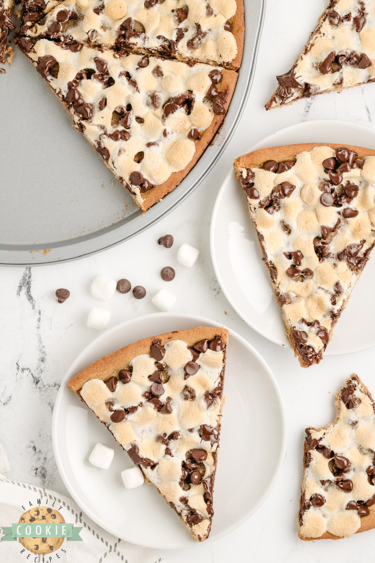 Peanut Butter Cookie Pizza is chewy, gooey, and loaded with marshmallows and chocolate. A fast, fun dessert everyone will love!