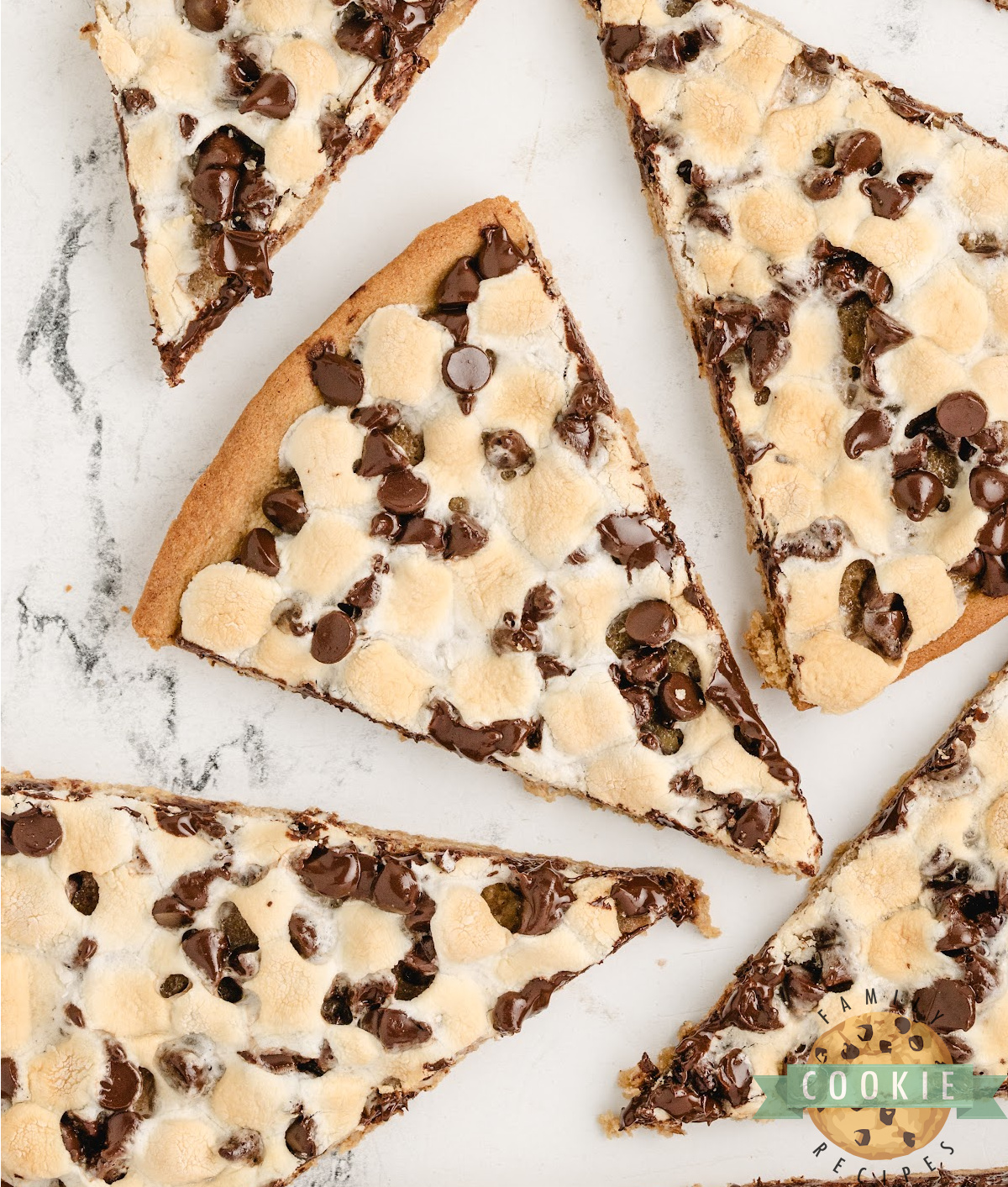 Peanut Butter Cookie Pizza is chewy, gooey, and loaded with marshmallows and chocolate. A fast, fun dessert everyone will love!