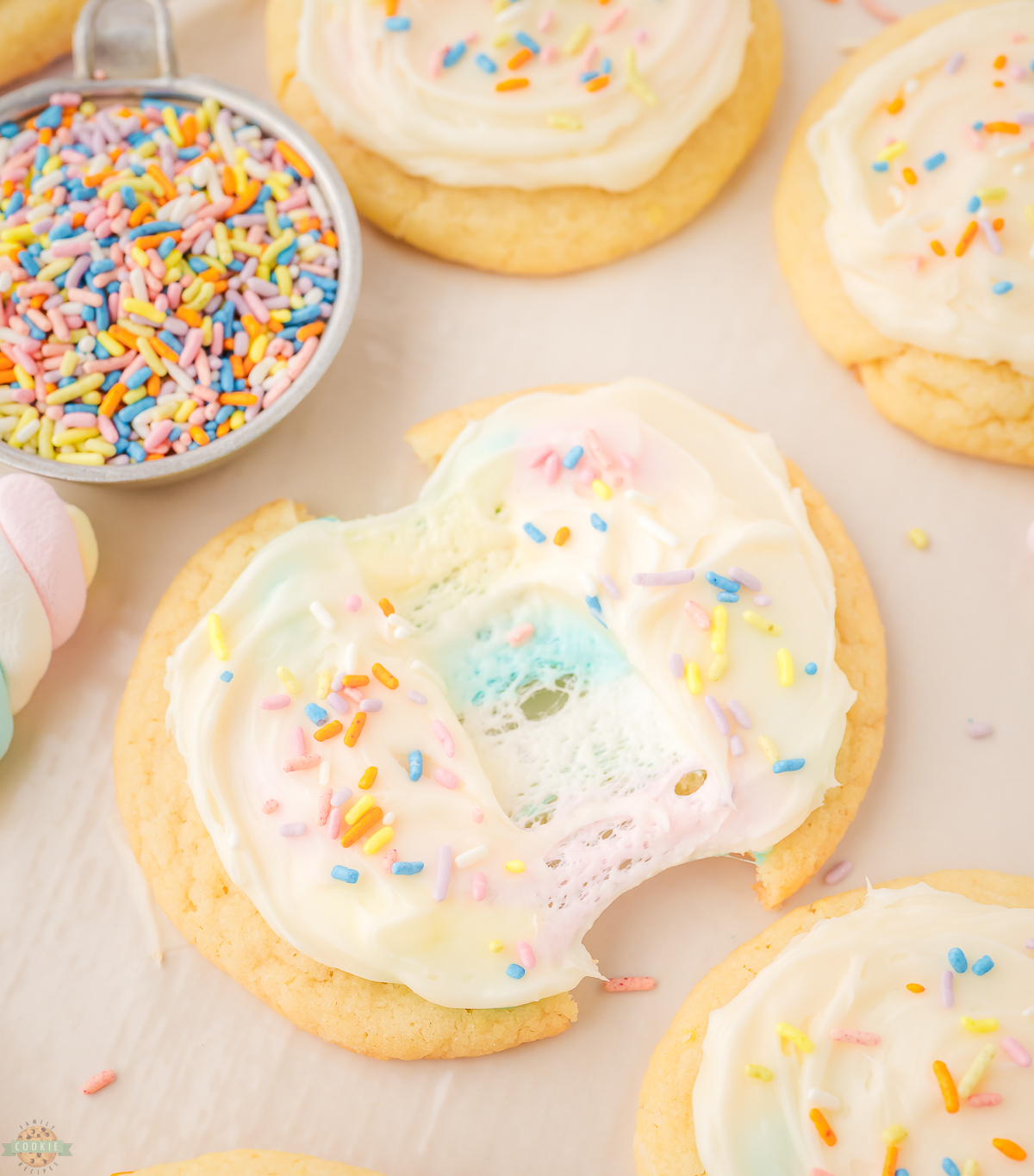 marshmallow surprise cookies with frosting and sprinkles