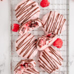 raspberry meringues drizzled with chocolate
